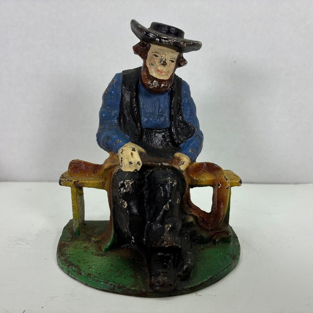 Cast Iron Doorstop/Bookend Amish Man Sitting on Bench